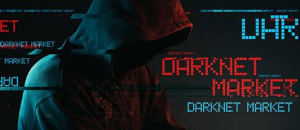 Hooded man with Darknet font surrounding him